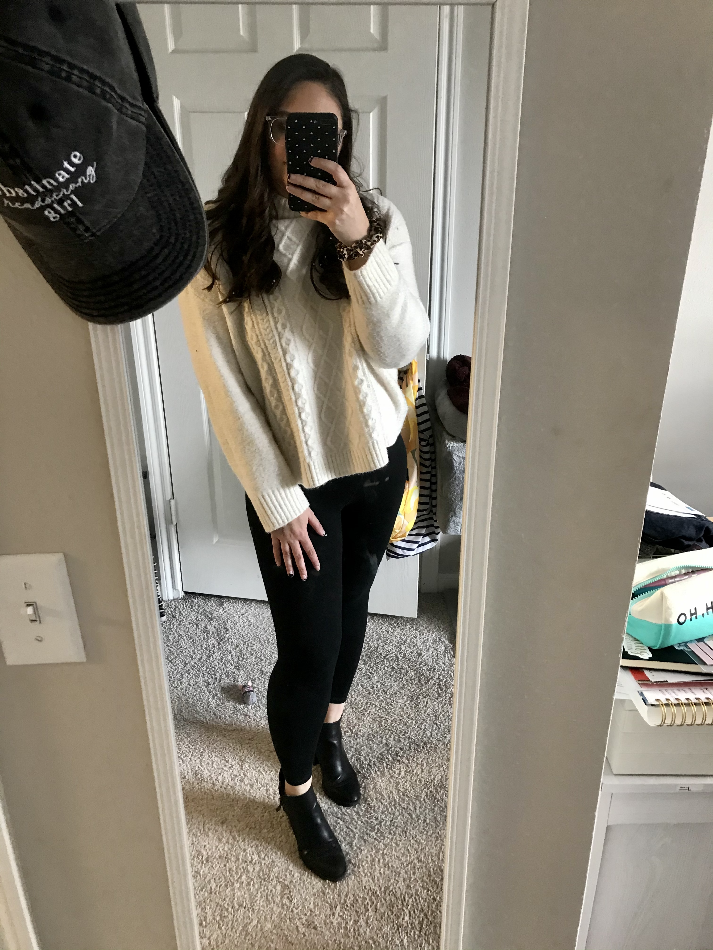 girl in white sweater and black leggings