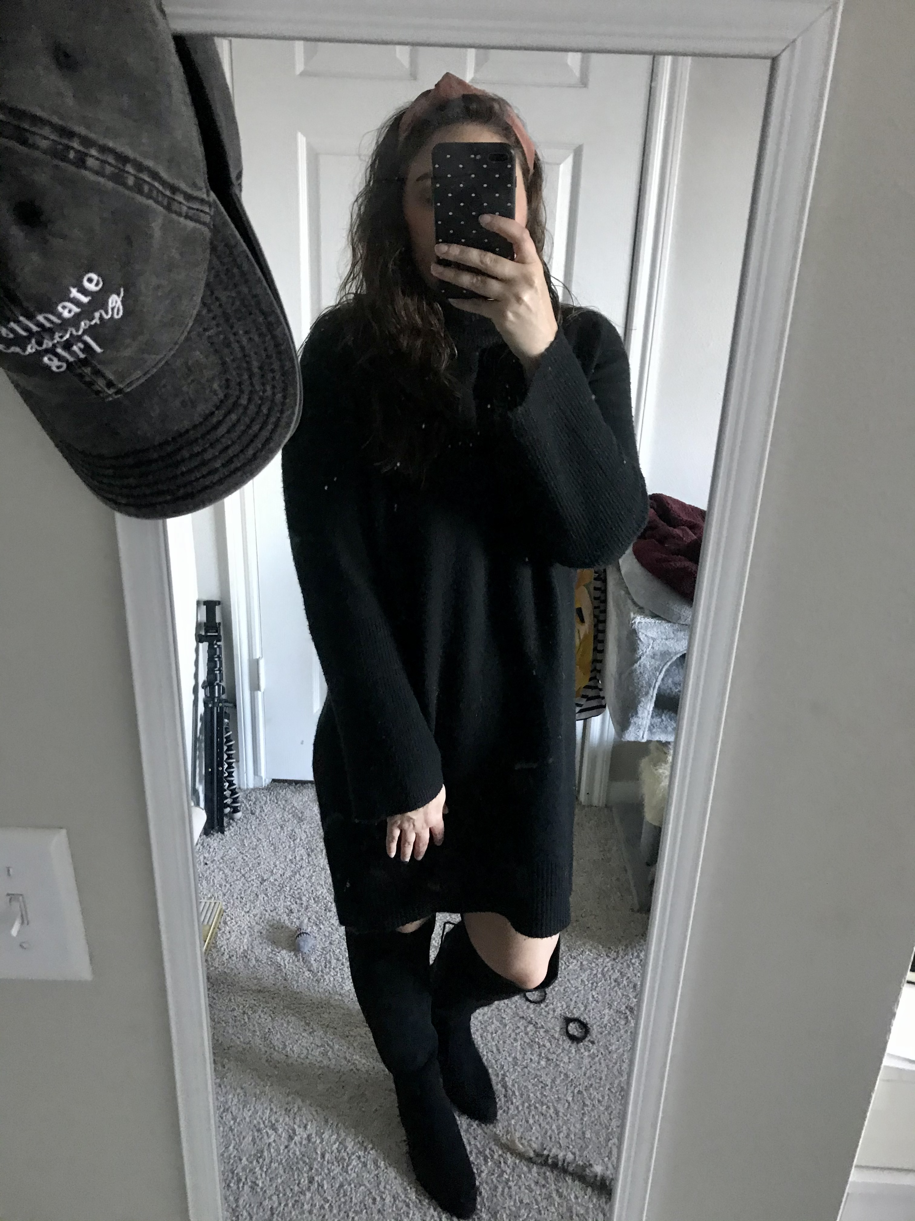 girl in black sweaterdress and knee high black boots