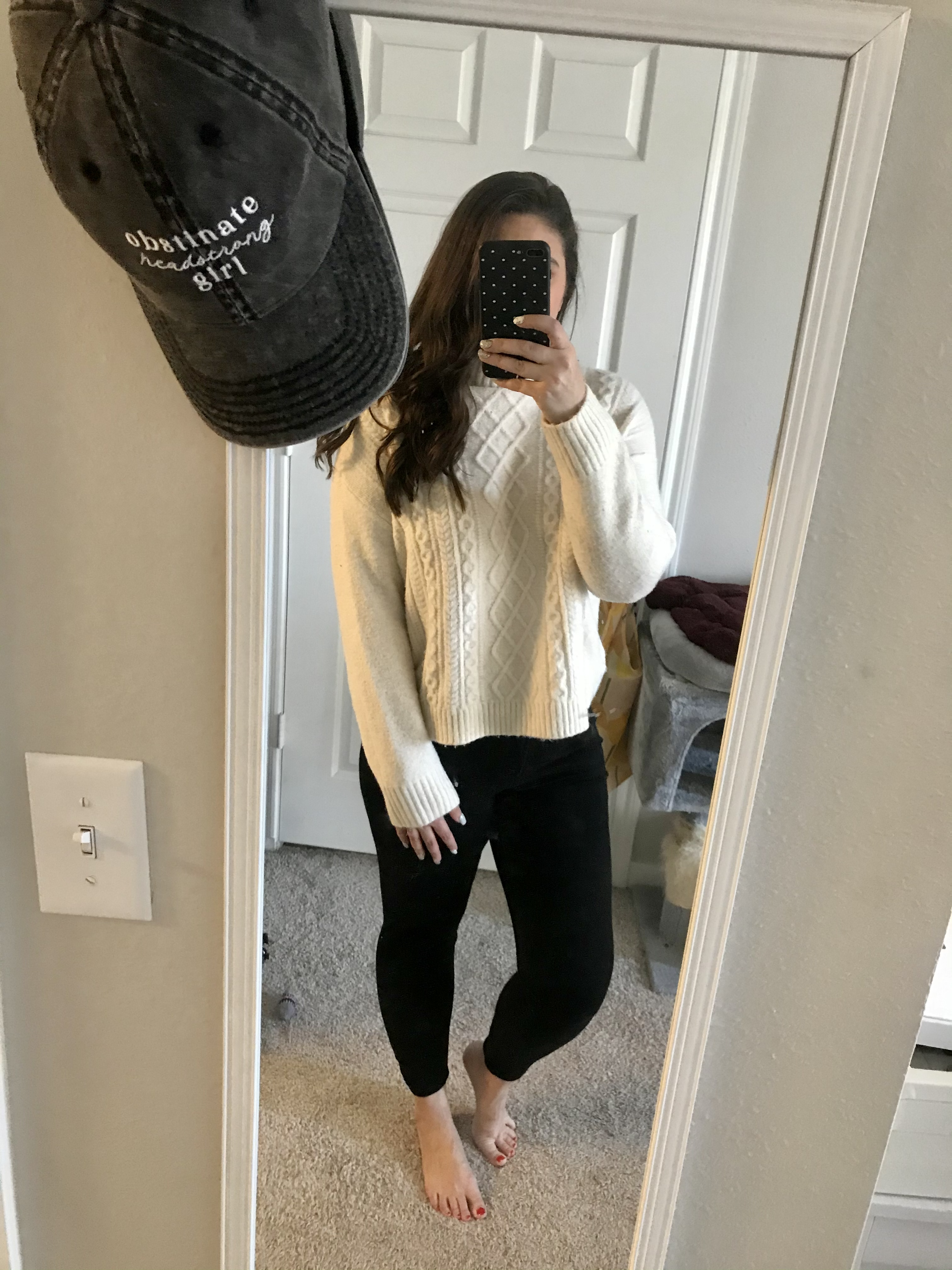 girl in white sweater and black jeans