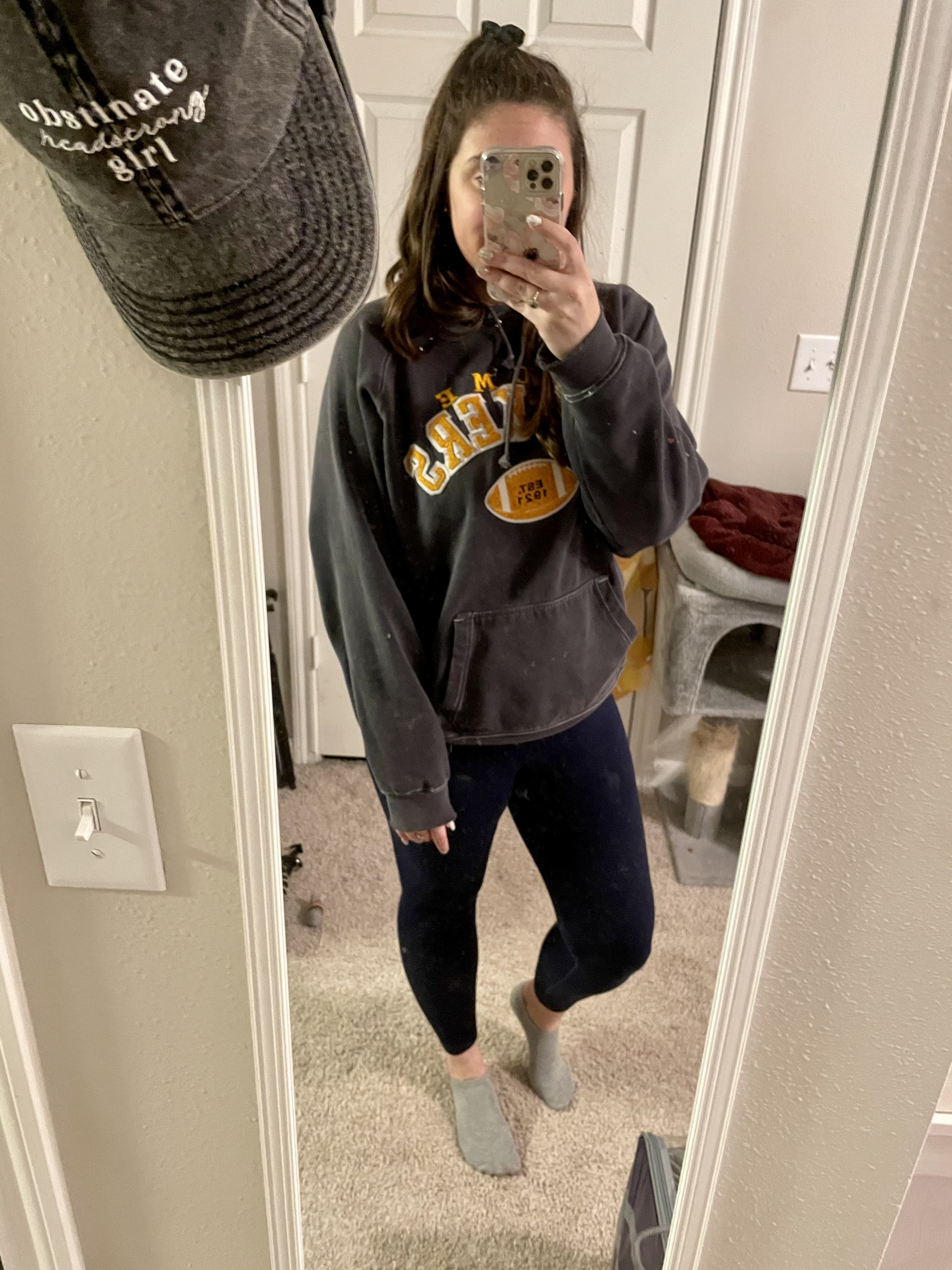 girl in packers sweatshirt and leggings