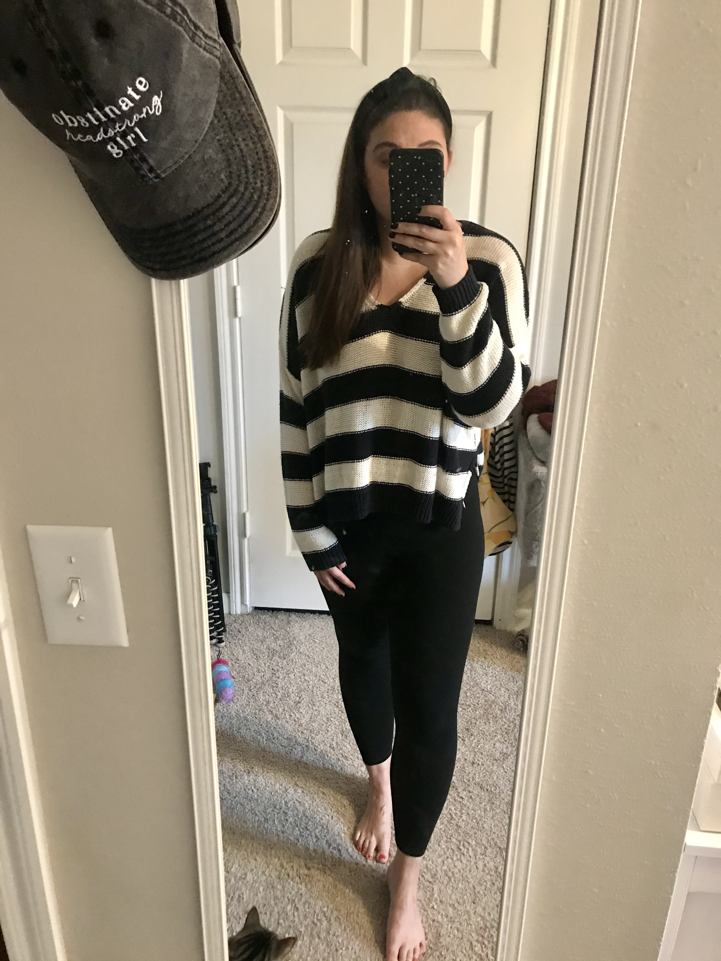 girl in blue and white striped sweater and leggings